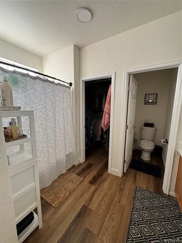 a bedroom with a bed and a rug