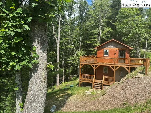 a front view of a house with parking area