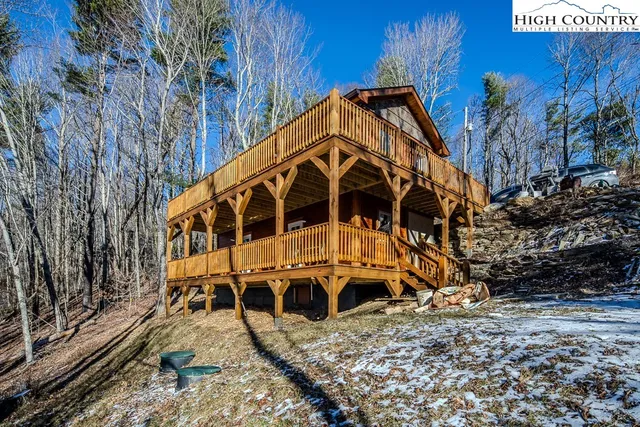 a view of a backyard with chairs
