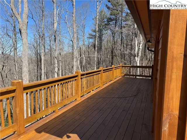 a view of balcony with wooden floor
