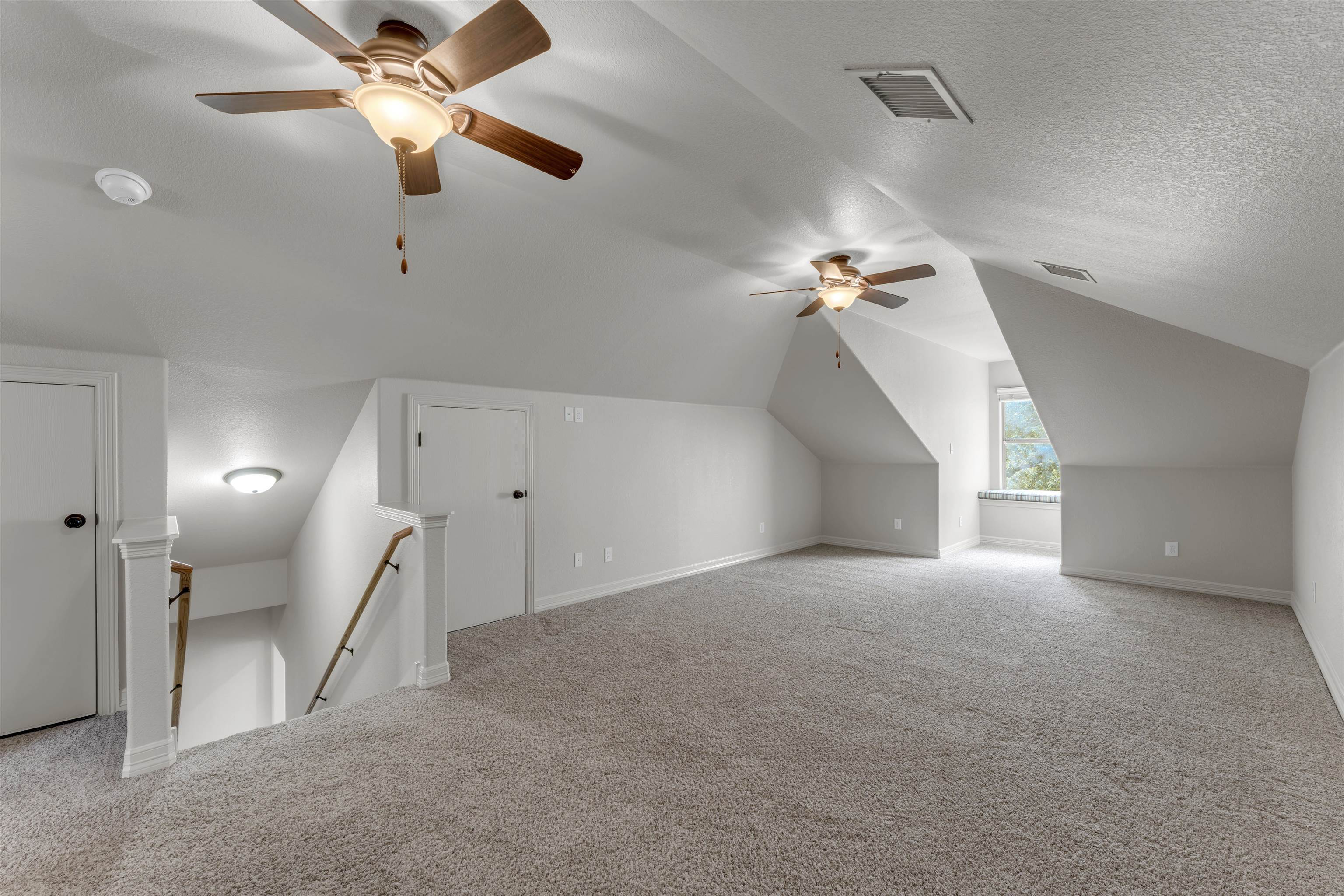 227 Watkins Point Kingsland, TX 78639 - Photo 20 of 30 a view of a big room with a ceiling fan and a chandelier fan