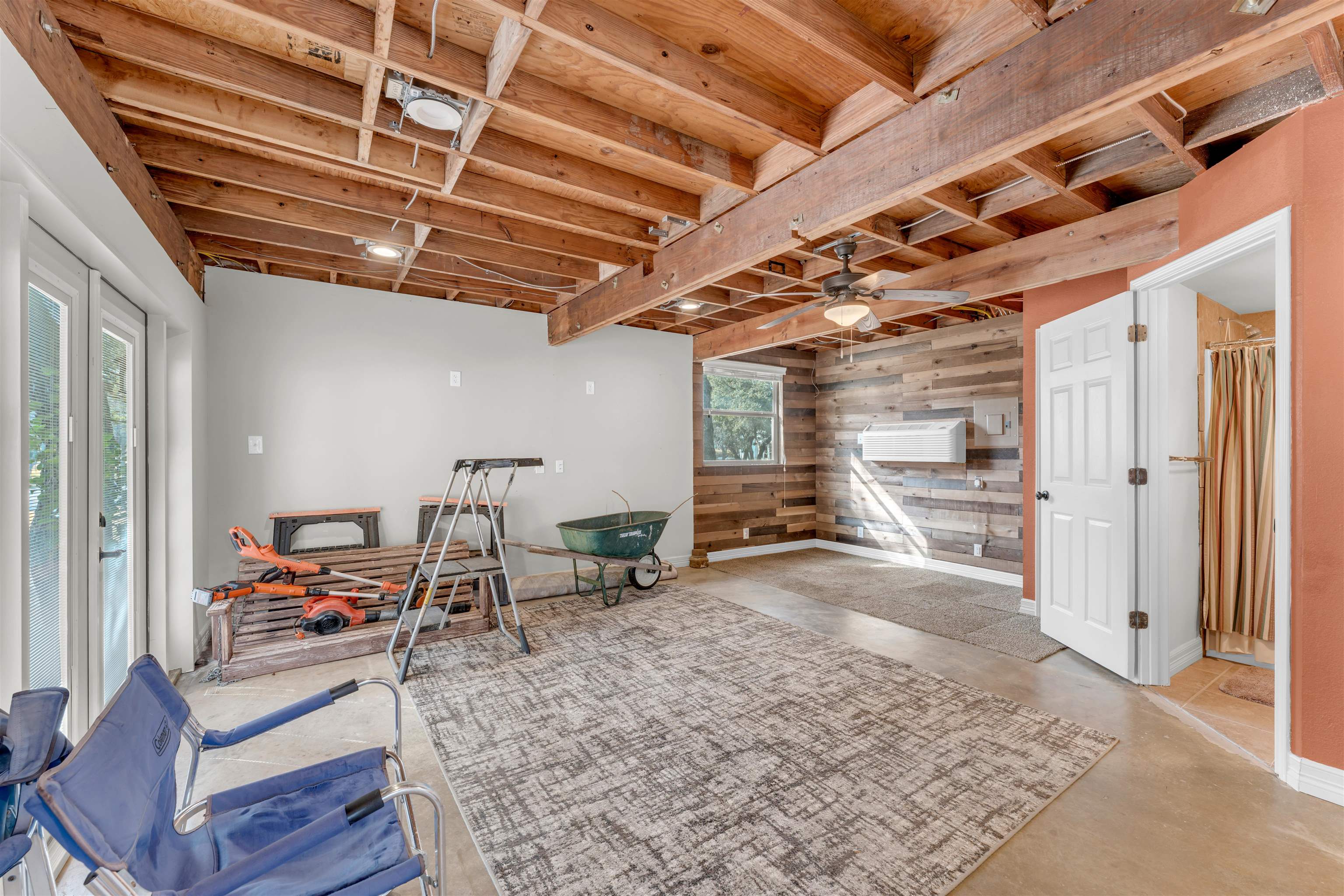 227 Watkins Point Kingsland, TX 78639 - Photo 23 of 30 a living room with lots of furniture and a chandelier
