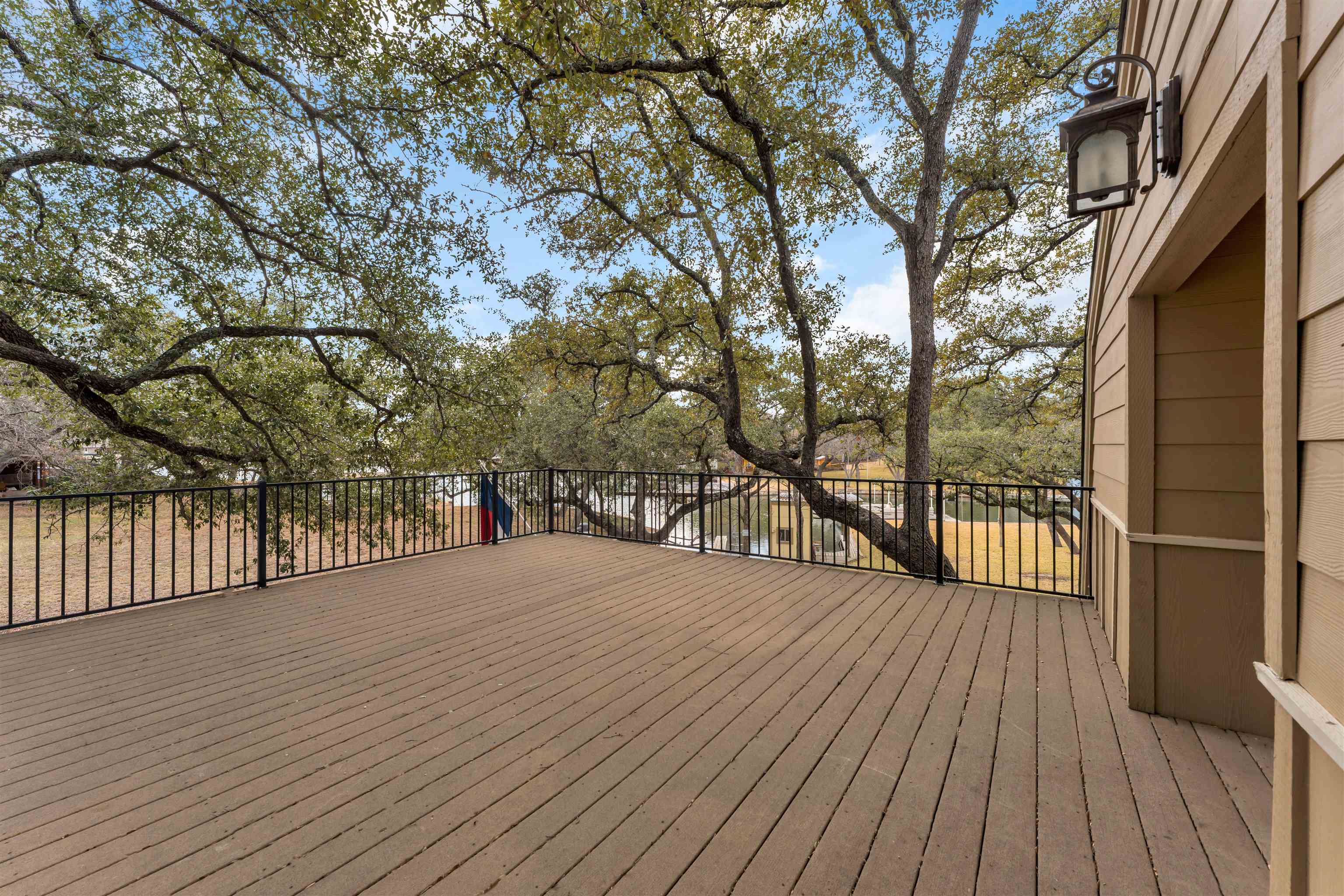 227 Watkins Point Kingsland, TX 78639 - Photo 24 of 30 a view of backyard with deck and wooden floor