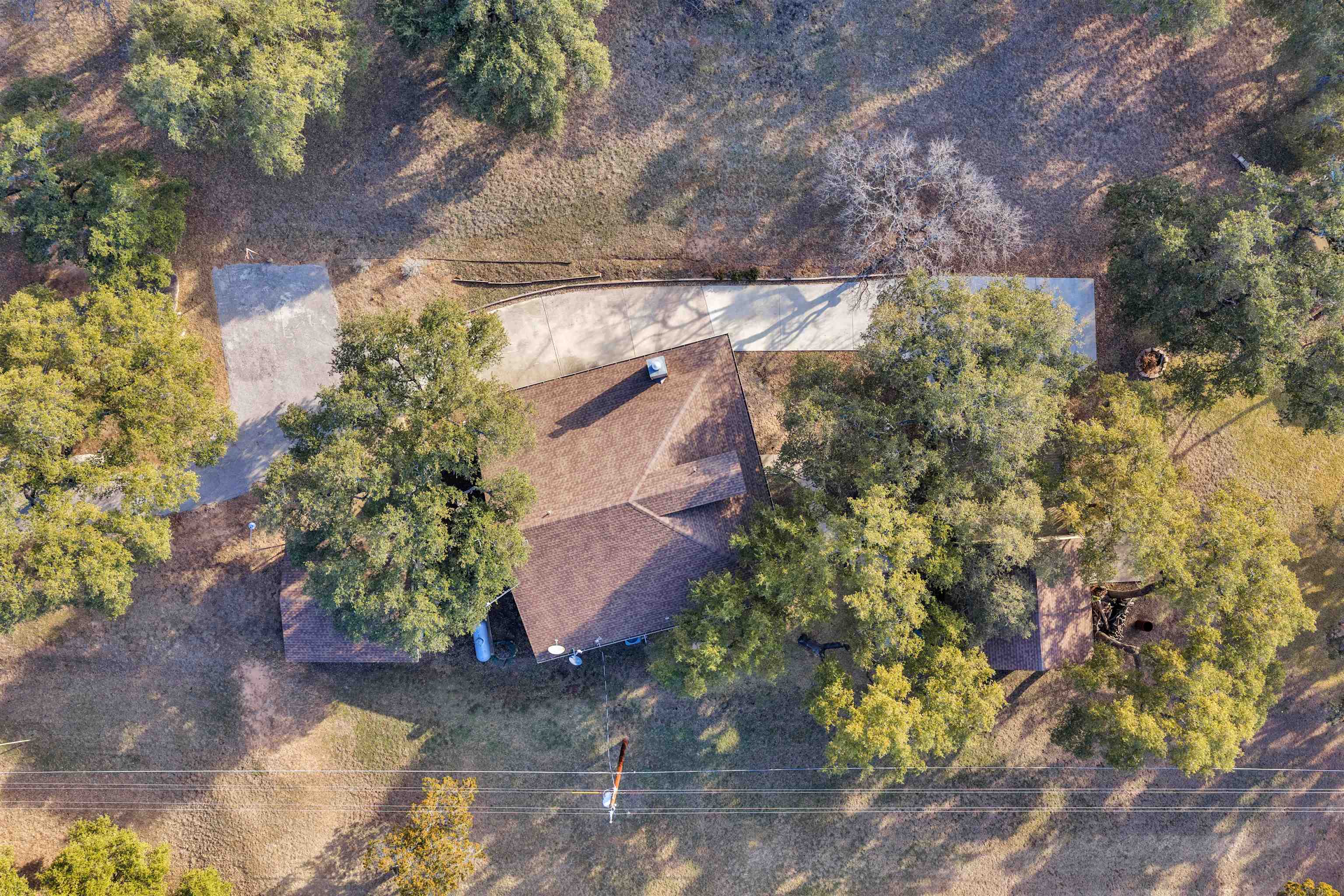 227 Watkins Point Kingsland, TX 78639 - Photo 27 of 30 a backyard of a house with lots of green space