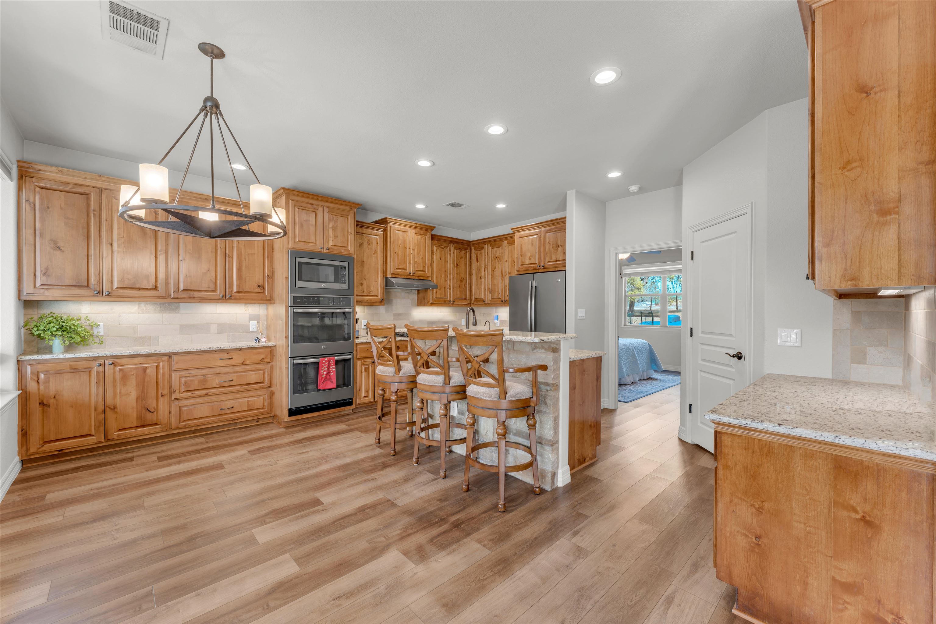 227 Watkins Point Kingsland, TX 78639 - Photo 8 of 30 a view of a kitchen and dining room