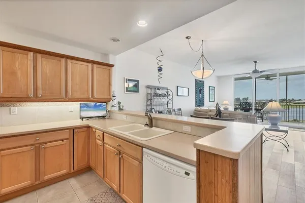 a utility room with cabinets washer and dryer