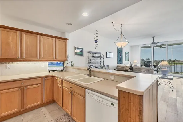 a utility room with cabinets washer and dryer