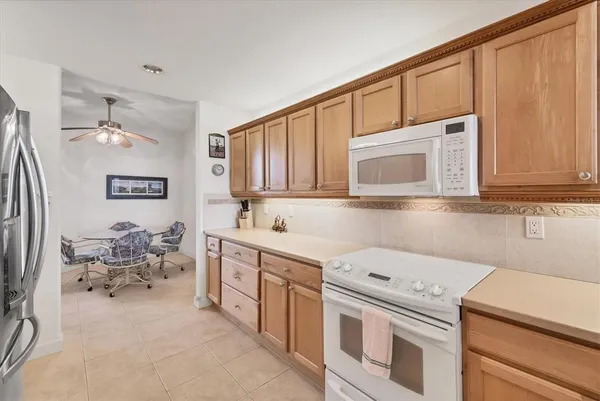 a view of a dining room with furniture wooden floor and a chandelier