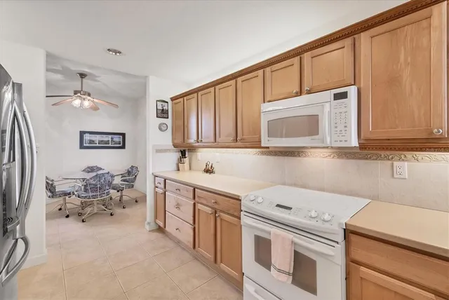 a view of a dining room with furniture wooden floor and a chandelier
