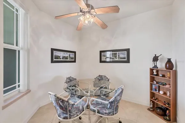 a view of a livingroom with furniture and a workspace