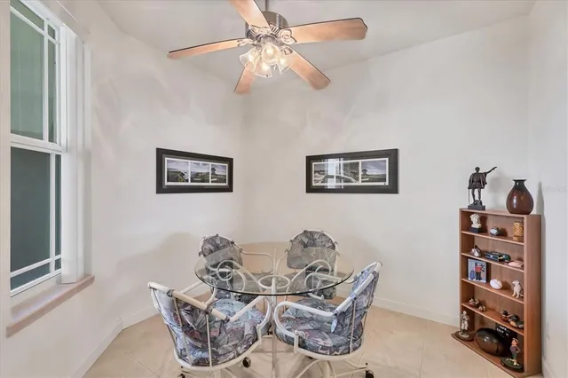 a view of a livingroom with furniture and a workspace