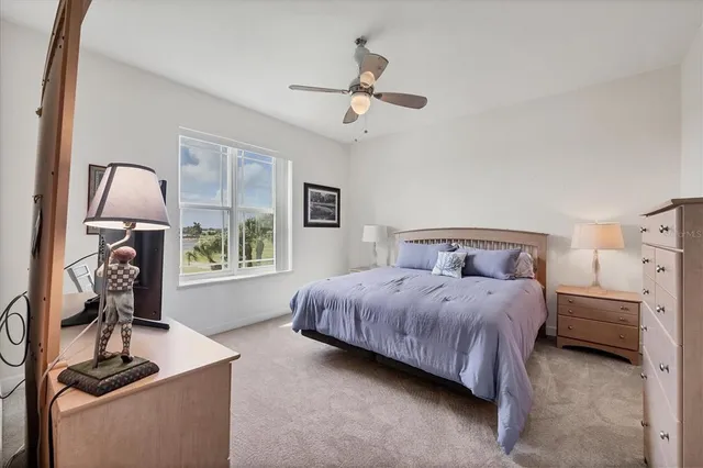 a bathroom with a granite countertop shower mirror and a toilet