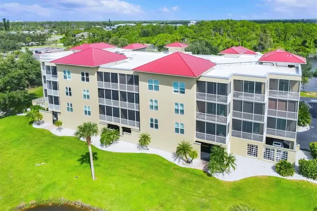 a view of a swimming pool a yard and outdoor seating