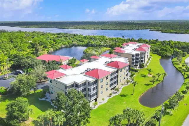 a view of a swimming pool with a table and chairs