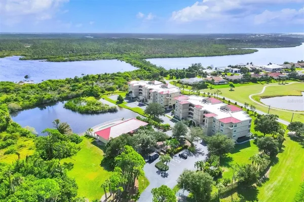 a view of a porch with furniture and a yard