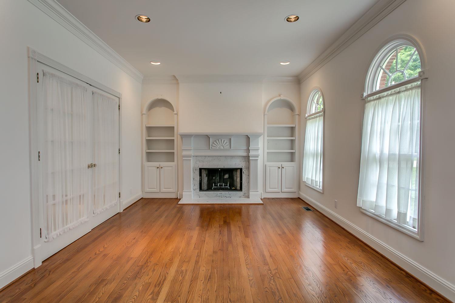Crown moldings with keystone & rosette accents.  Built in book cases in formal living room/library
