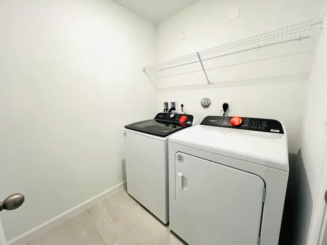 a utility room with dryer and washer