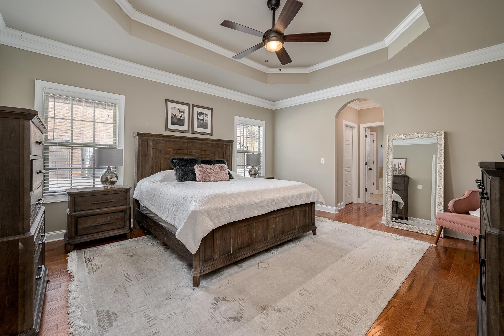 640 Twin View Drive Murfreesboro, TN 37128 - Photo 17 of 33 a bedroom with a large bed and a chandelier