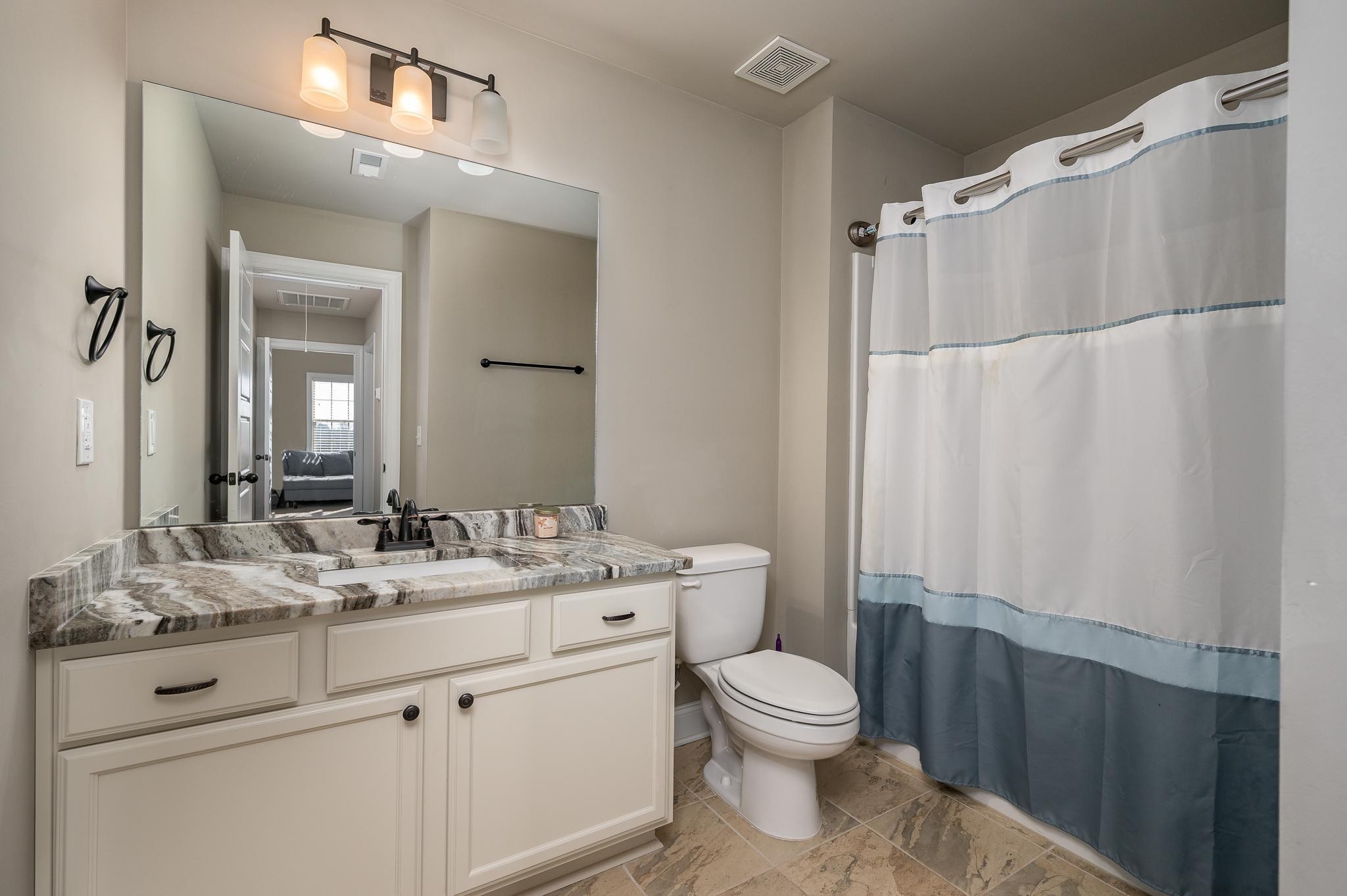 640 Twin View Drive Murfreesboro, TN 37128 - Photo 23 of 33 a bathroom with a granite countertop sink toilet and shower