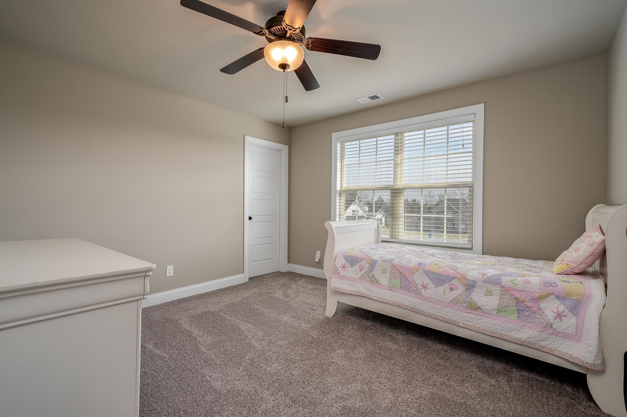 640 Twin View Drive Murfreesboro, TN 37128 - Photo 24 of 33 a bedroom with a bed and a ceiling fan