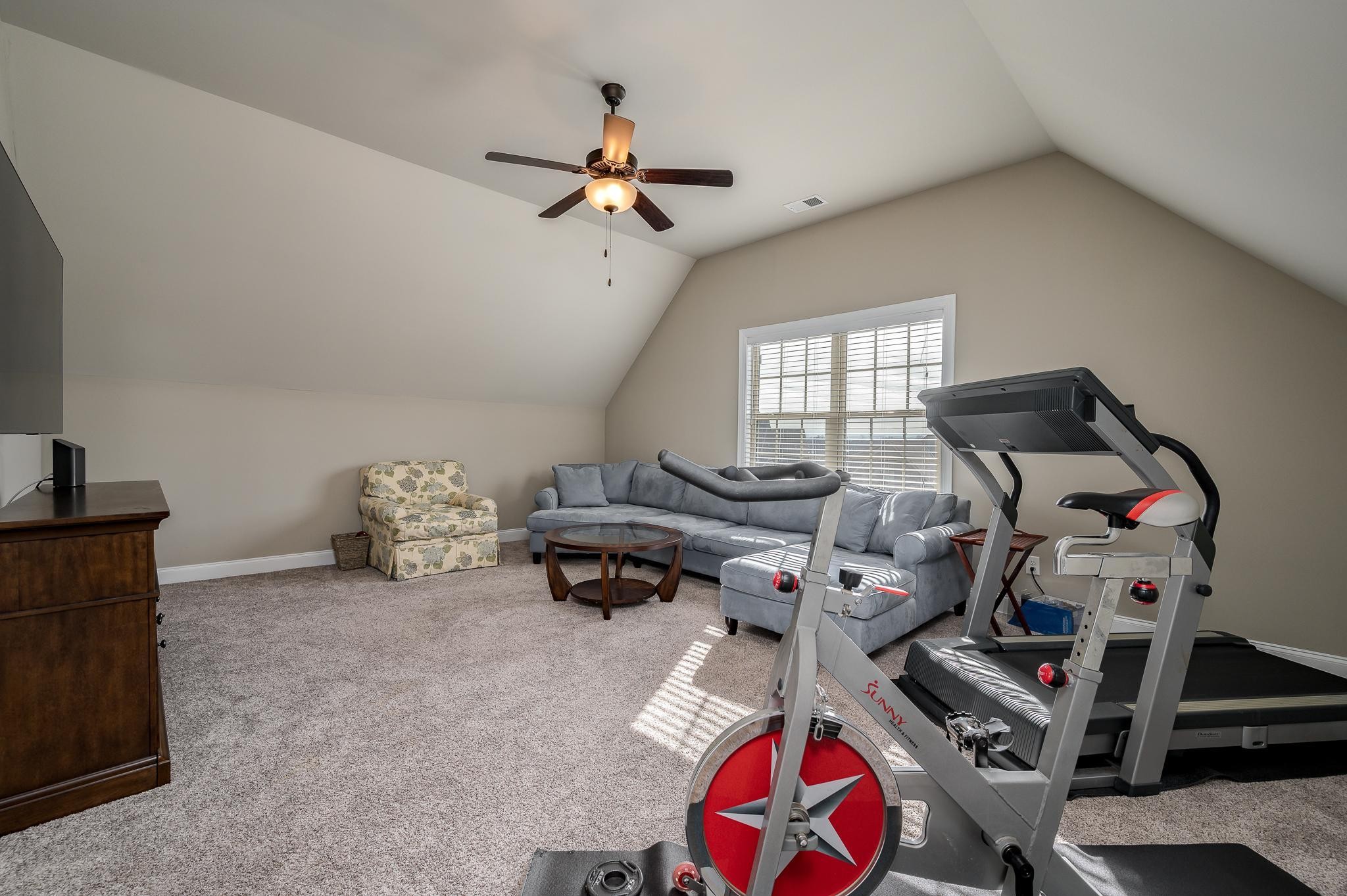 640 Twin View Drive Murfreesboro, TN 37128 - Photo 25 of 33 a living room with furniture and a flat screen tv