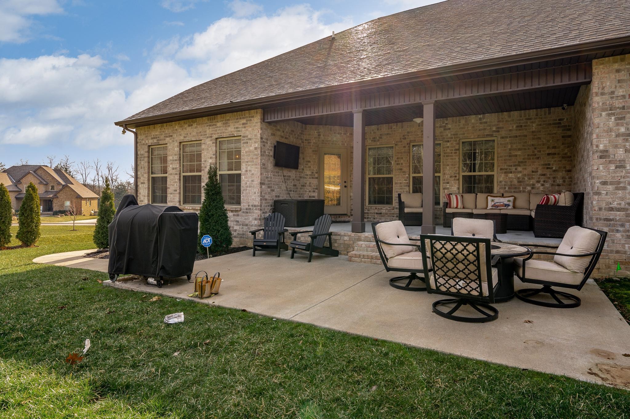 640 Twin View Drive Murfreesboro, TN 37128 - Photo 28 of 33 a view of a patio with table and chairs potted plants and a large window