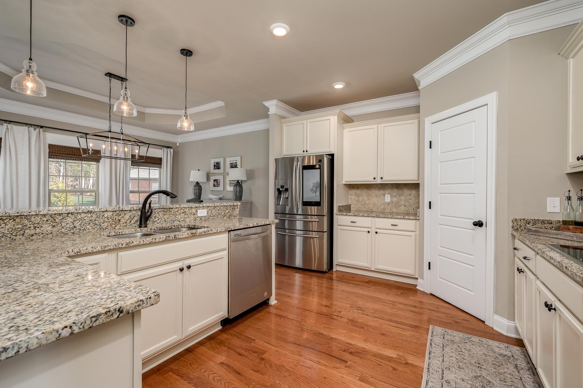 640 Twin View Drive Murfreesboro, TN 37128 - Photo 7 of 33 a kitchen with stainless steel appliances granite countertop a sink refrigerator and cabinets