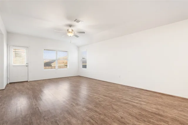 a view of kitchen with stainless steel appliances refrigerator oven and cabinets