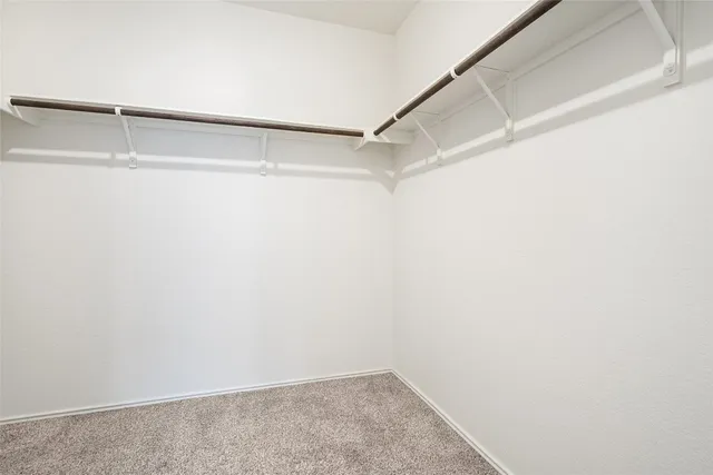 a spacious bathroom with a mirror a sink and a bathtub