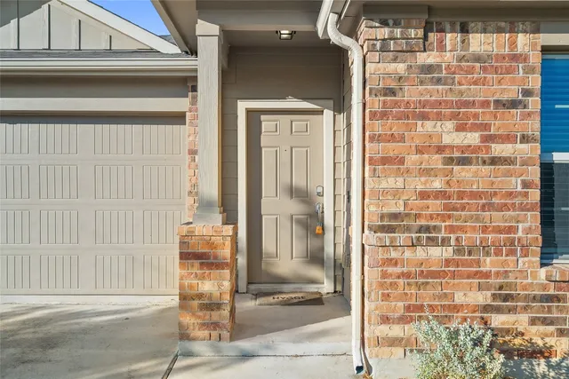 a front view of a house with a glass door