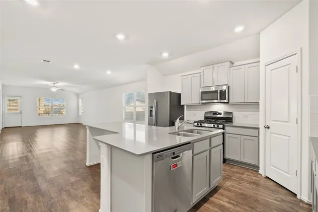 a view of a house with wooden fence