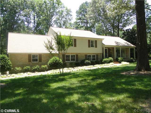 12811 Singer Road Midlothian, VA 23112 - Photo 1 of 12 a front view of a house with a yard