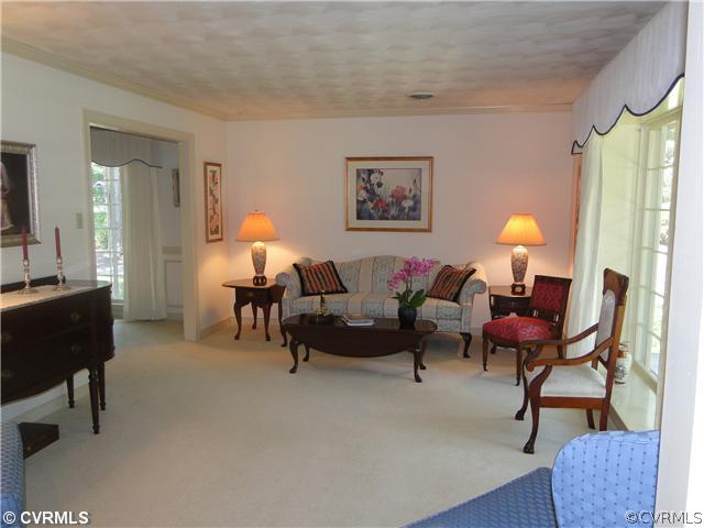 12811 Singer Road Midlothian, VA 23112 - Photo 5 of 12 a living room with furniture and a fireplace