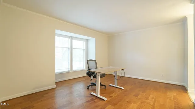 a workspace with furniture and a window