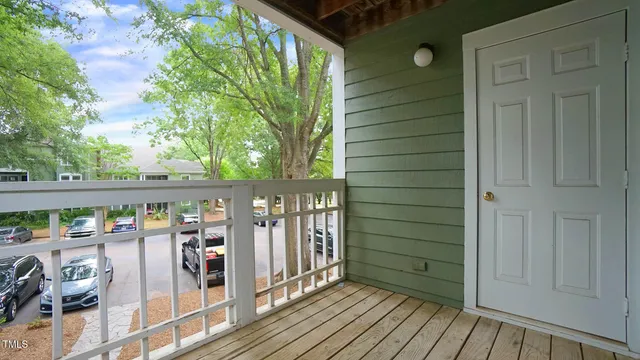 a view of a balcony with wooden floor