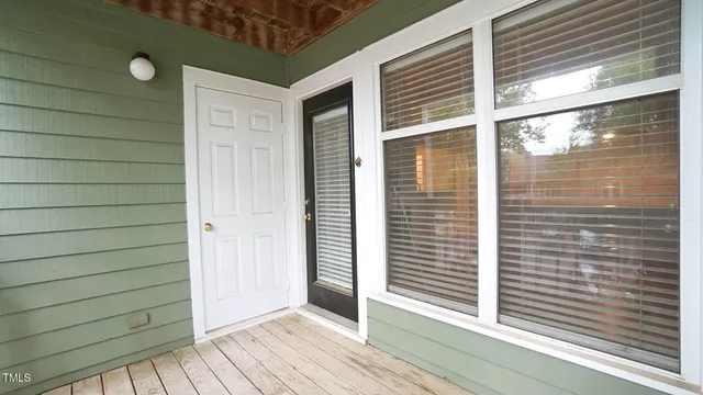a view of front door and porch area