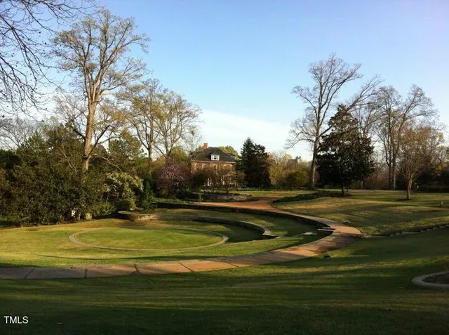 a view of swimming pool is middle in the garden