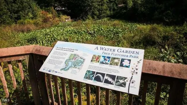 a view of a balcony with wooden floor and outdoor space