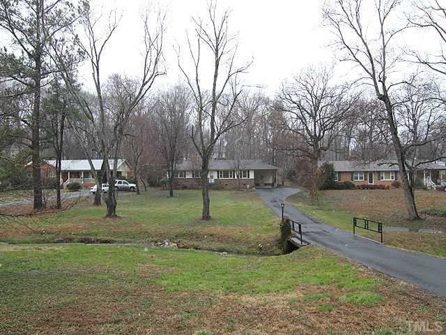 View of home from street shows the large front yard. Gutters have just been cleaned and exterior power washed. One year home warranty included. Exterior Front