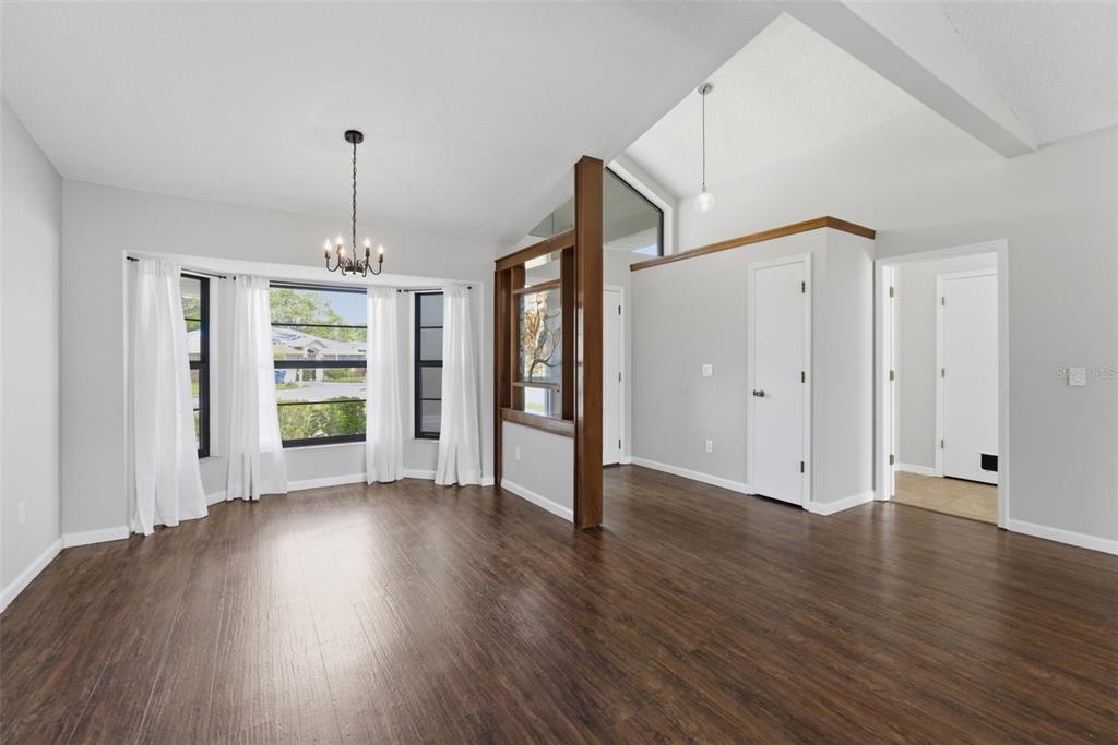 4966 Keysville Avenue Spring Hill, FL 34608 - Photo 10 of 48 a view of empty room with wooden floor and window