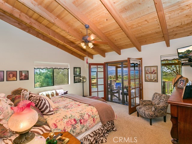 34220 Black Mountain Road Temecula, CA 92592 - Photo 26 of 57 a bed room with a bed and a large window