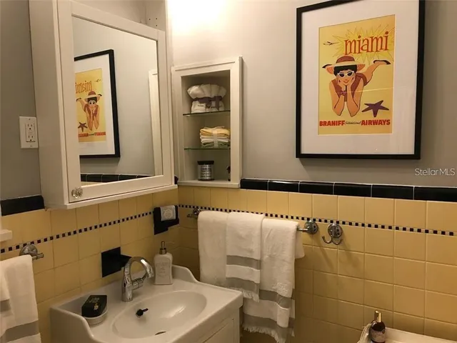 a bathroom with a sink and a mirror