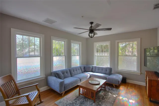 a living room with furniture and a window