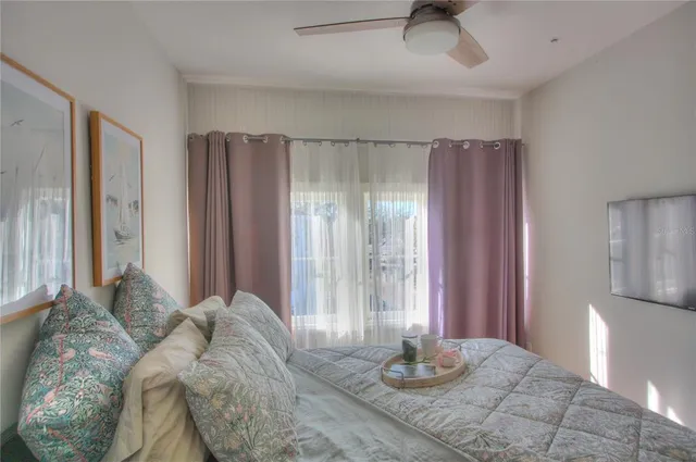 a bedroom with furniture and a window