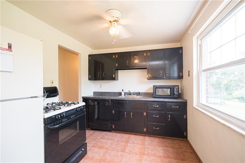 EFFICIENTLY DESIGNED EQUIPPED KITCHEN...JUST MOVE IN BECAUSE STOVE, REFRIGERATOR, DISHWASHER AND MICROWAVE OVEN ARE INCLUDED.