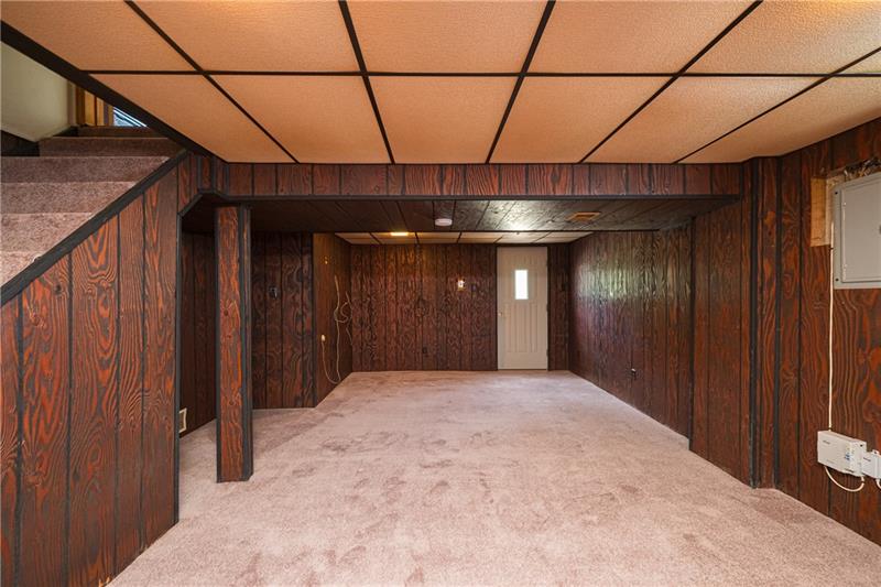 GAMEROOM, SO GENEROUSLY SIZED AND SPORTING BRAND NEW WALL TO WALL CARPETING.