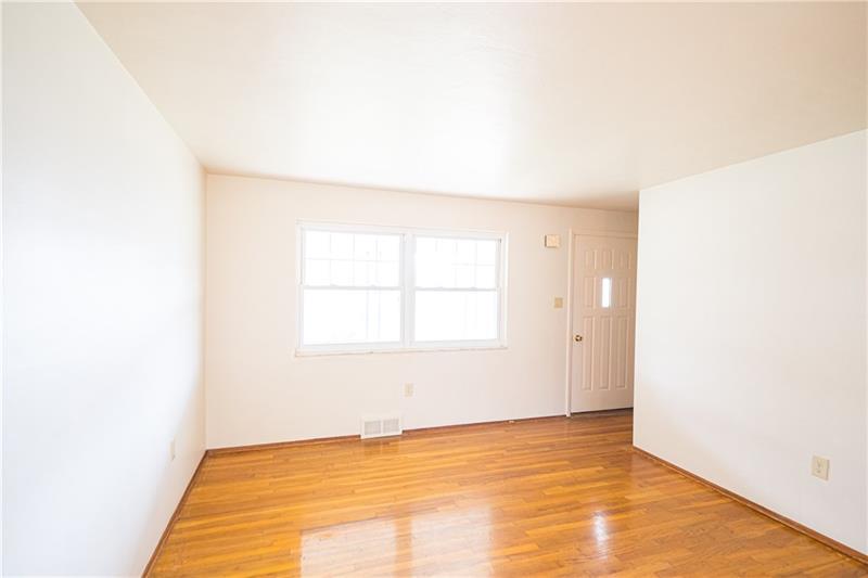 31 Highbury Road Cheswick, PA 15024 - Photo 8 of 25 LIVINGROOM WITH LOTS OF NATURAL LIGHT AND EXPOSED HARDWOOD FLOORS.