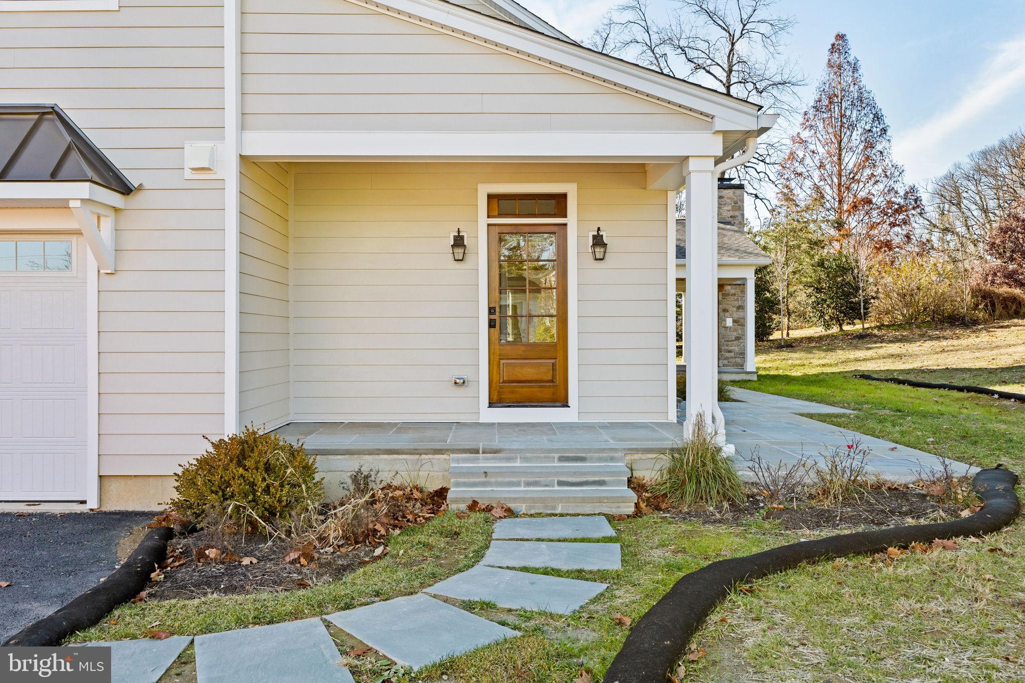 16 Fariston Road Wayne, PA 19087 - Photo 105 of 106 a front view of a house with garden