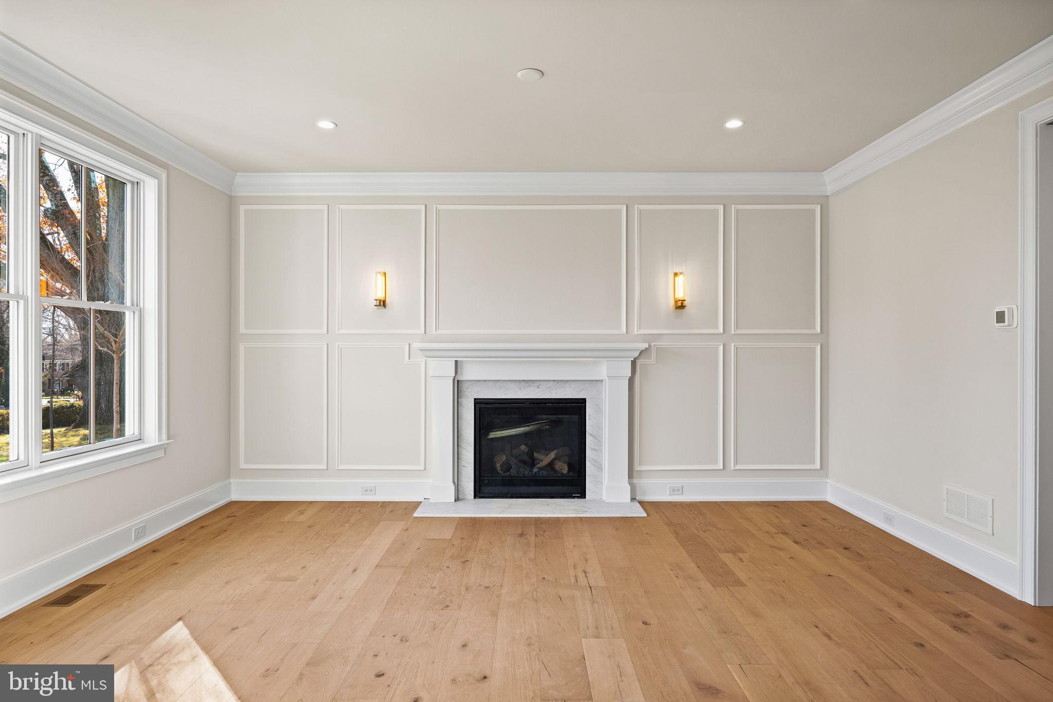 16 Fariston Road Wayne, PA 19087 - Photo 11 of 106 a view of empty room with a fireplace and wooden floor