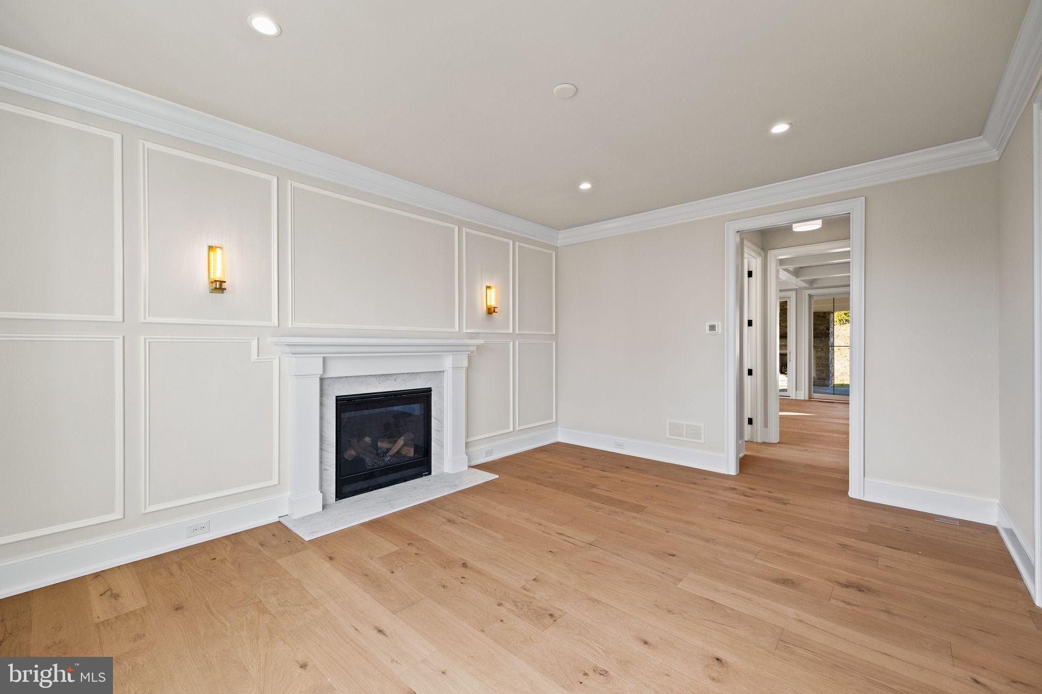 16 Fariston Road Wayne, PA 19087 - Photo 13 of 106 a view of an empty room with wooden floor fireplace and a window